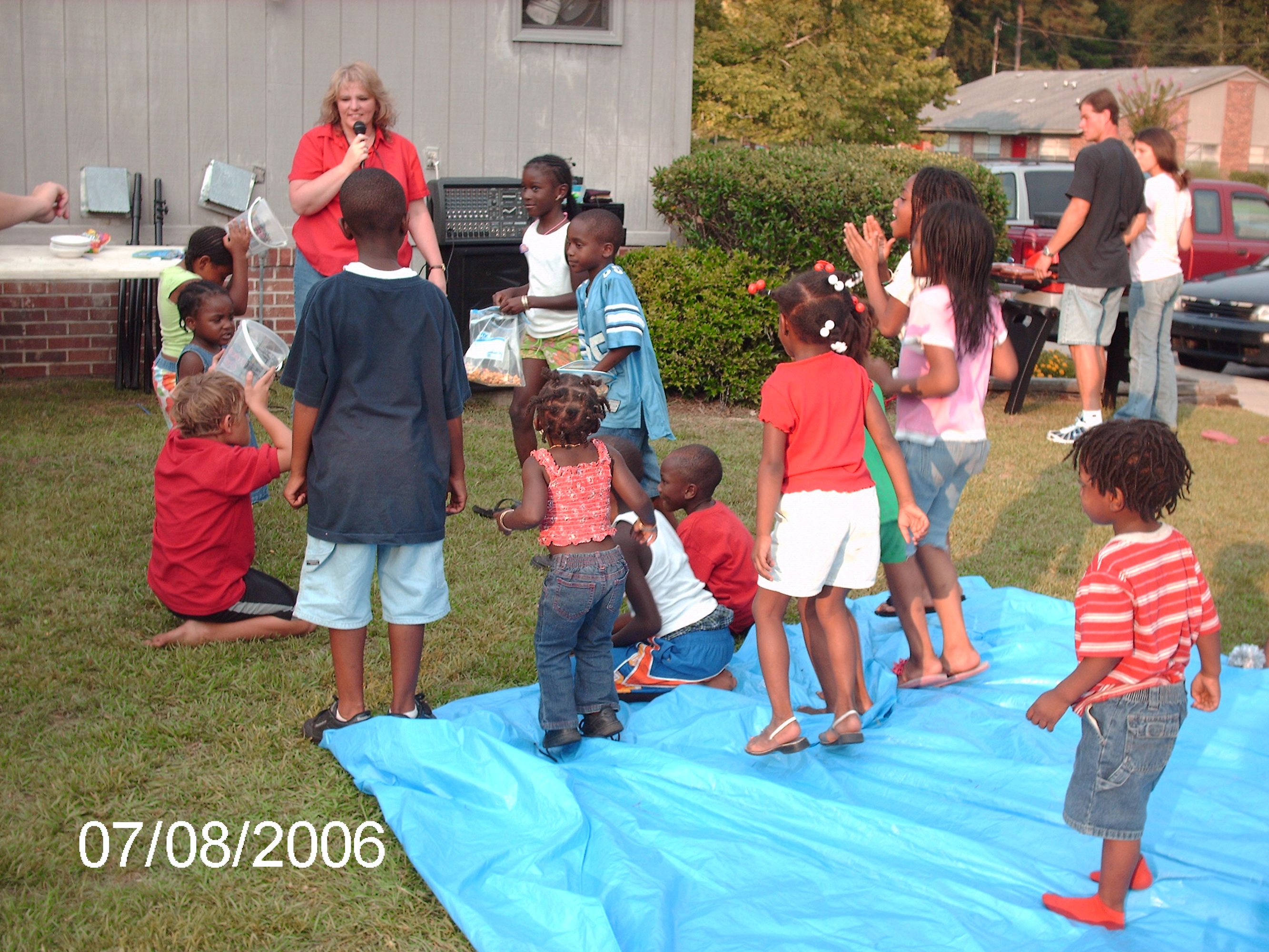 Front yard Kids and adults in outdoor planned event
