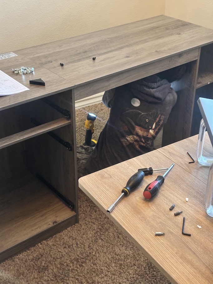 Kid working on a desk with a cat sweatshirt