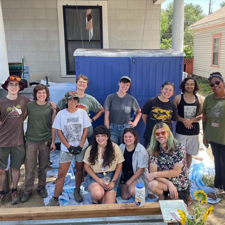 Volunteers posing with supplies