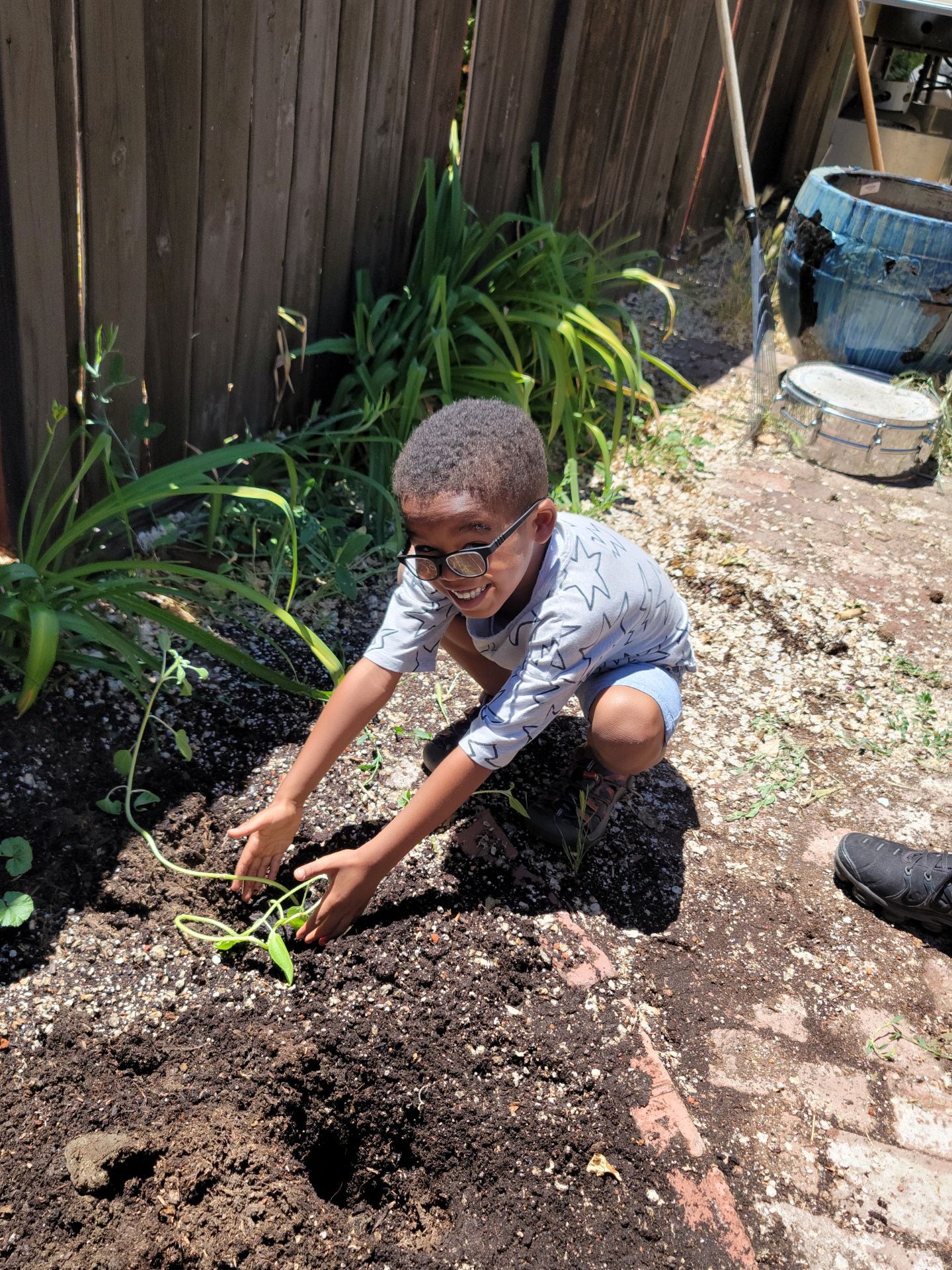 Child celebrating the plant they just helped with